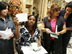 Women at Grameen American Bank in Queens show their collateral free loan documents.