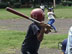 A young Nicaraguan player at bat as baseball scouts watch, ready to recruit the best players and, at times, exploit them.